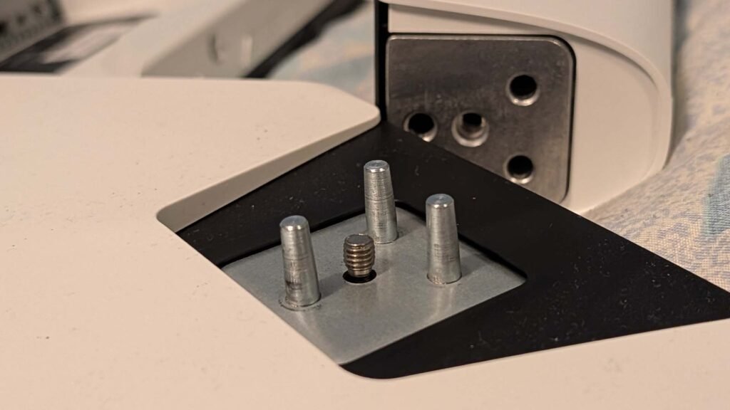 An image showing the locating pins to mount the stand.